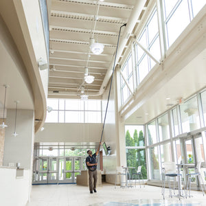 Cleaning a high HVAC duct from the floor with GoHigh Max in an atrium